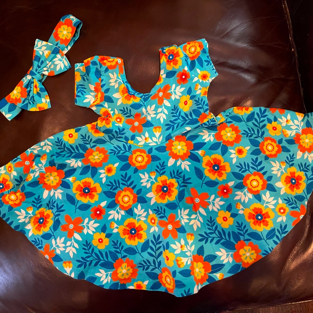 Eleanor Rose dress and elastic ribbon in an adorable turquoise floral design.